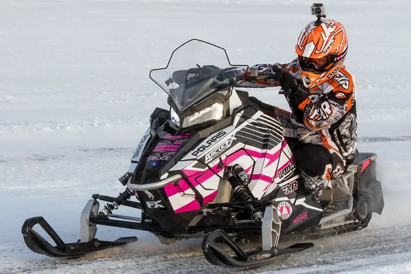 A Polaris Axys Trail snowmobile with a pink, black, and white Deathbound custom vinyl wrap.